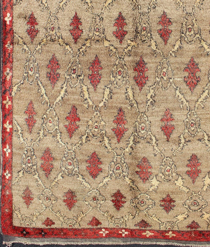 Mid Century Tulu Carpet in Sand color background. This mid century Tulu rug features repeating red motifs laid across a sand - colored field and enclosed within similarly - colored frames. Tulu rugs were woven in Konya area, in central Anato... - Keivan Woven ArtsEN - 623 - 4842Rug