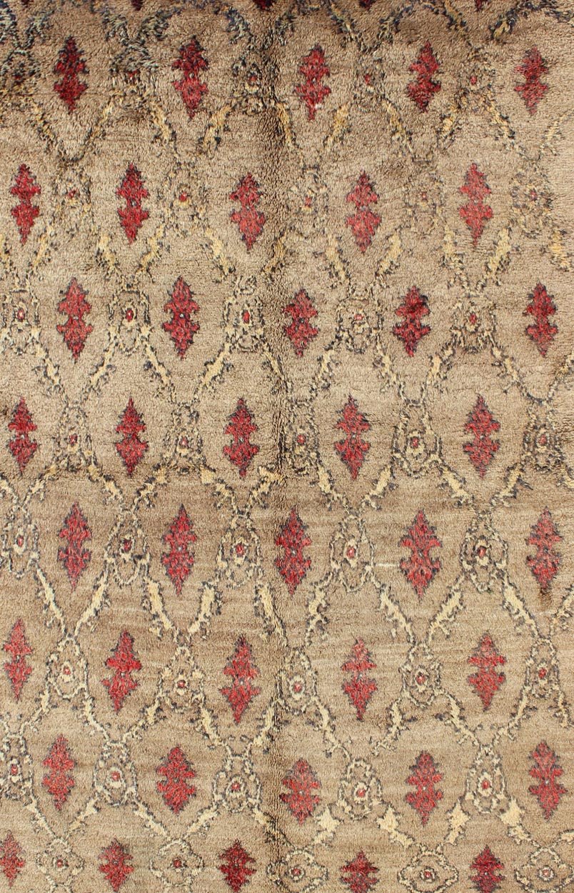 Mid Century Tulu Carpet in Sand color background. This mid century Tulu rug features repeating red motifs laid across a sand - colored field and enclosed within similarly - colored frames. Tulu rugs were woven in Konya area, in central Anato... - Keivan Woven ArtsEN - 623 - 4842Rug