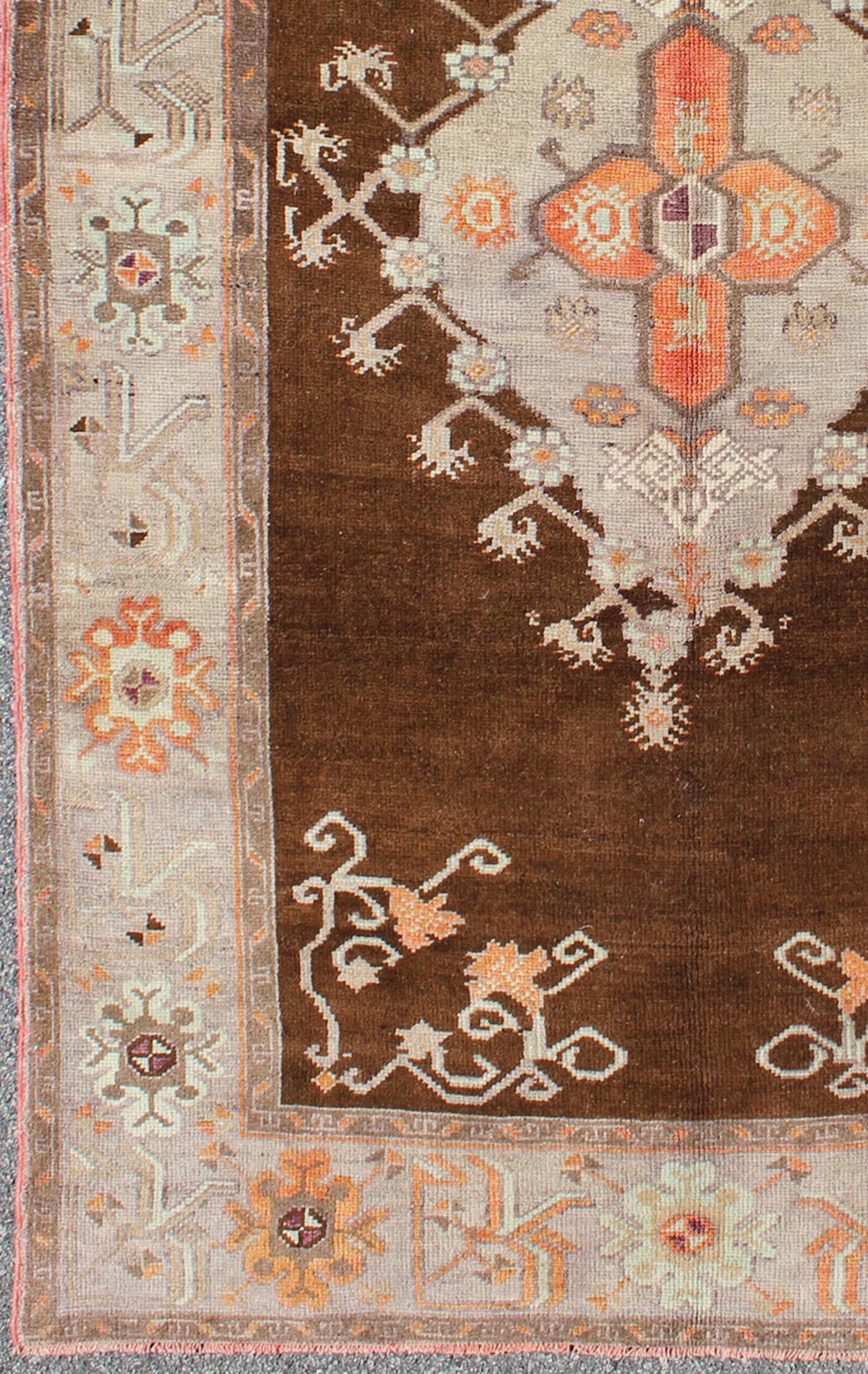 Vintage Turkish Medallion Oushak in Brown, Taupe, Gray, silver and Orange Measures: 5'1 x 8'10 This Turkish Oushak features a chocolate - brown background with a light gray and taupe border. The vibrant pop of orange color balances beautifu... - Keivan Woven ArtsEN - 6301 - 3824Rug