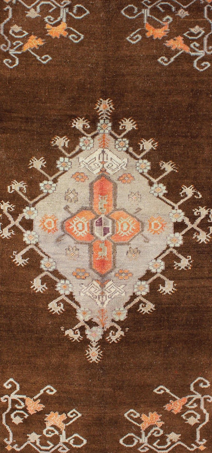 Vintage Turkish Medallion Oushak in Brown, Taupe, Gray, silver and Orange Measures: 5'1 x 8'10 This Turkish Oushak features a chocolate - brown background with a light gray and taupe border. The vibrant pop of orange color balances beautifu... - Keivan Woven ArtsEN - 6301 - 3824Rug