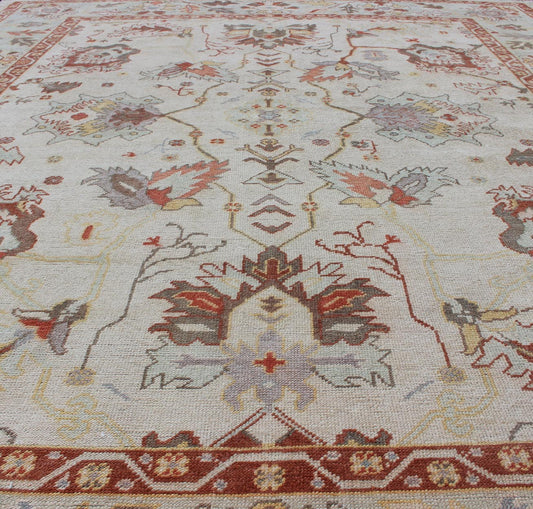 Turkish Oushak Rug with Muted Color. Measures: 10'1 x 12'5. This traditional Oushak rug from Turkey features a subdued, neutral color palette and an all - over design of floral shapes, surrounded beautifully by an all - encompassing, complementary bo... - Keivan Woven ArtsEN - 649 - 4858