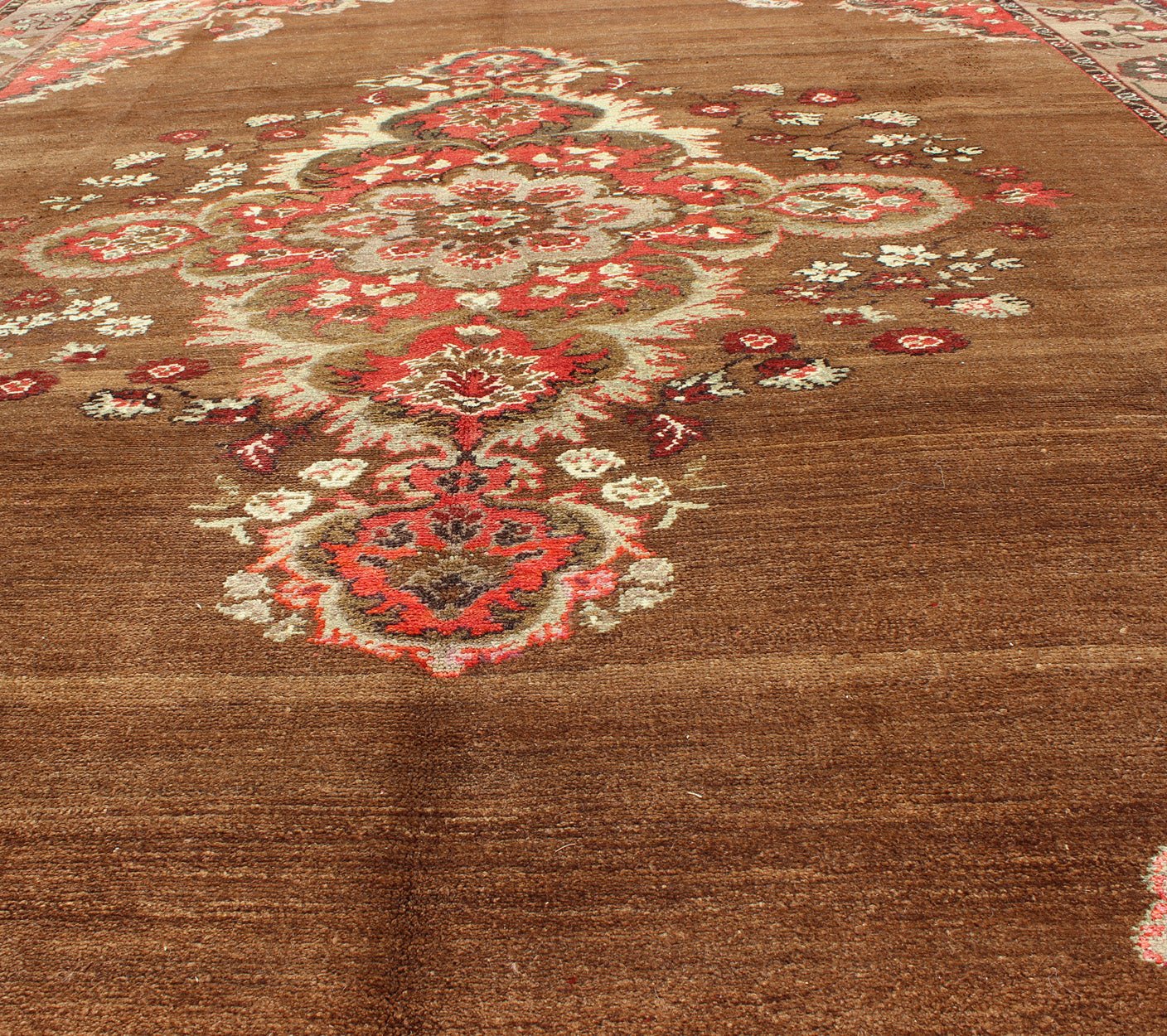 Vintage Turkish Rug with Unique Colors in Brown, Taupe, Green and Gray Measures: 8'8 x 11'3. This very unique carpet, from eastern Turkey, displays a brown background with a gray/taupe border. The orange corners add vibrancy to the rug whil... - Keivan Woven ArtsEN - 677 - 3830Rug