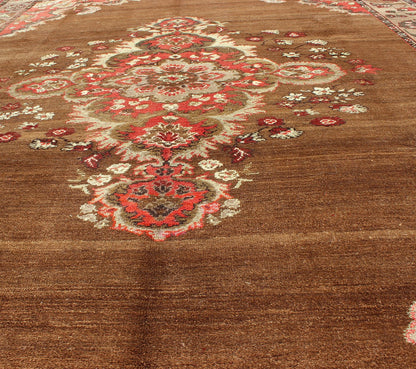 Vintage Turkish Rug with Unique Colors in Brown, Taupe, Green and Gray Measures: 8'8 x 11'3. This very unique carpet, from eastern Turkey, displays a brown background with a gray/taupe border. The orange corners add vibrancy to the rug whil... - Keivan Woven ArtsEN - 677 - 3830Rug