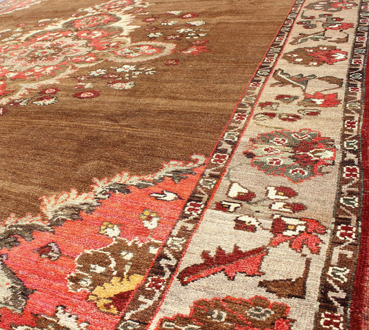 Vintage Turkish Rug with Unique Colors in Brown, Taupe, Green and Gray Measures: 8'8 x 11'3. This very unique carpet, from eastern Turkey, displays a brown background with a gray/taupe border. The orange corners add vibrancy to the rug whil... - Keivan Woven ArtsEN - 677 - 3830Rug