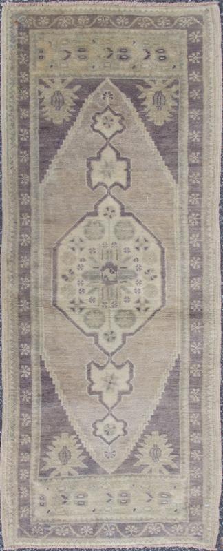 Vintage Turkish Oushak Carpet with Medallion in Dark Gray/Purple and Ivory This Turkish Oushak carpet features a central medallion design, as well as patterns of smaller geometric shapes and botanical elements. The rug's qualities are enhanced b... - Keivan Woven ArtsEN - 713 - 3840Rug