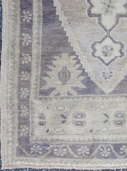 Vintage Turkish Oushak Carpet with Medallion in Dark Gray/Purple and Ivory This Turkish Oushak carpet features a central medallion design, as well as patterns of smaller geometric shapes and botanical elements. The rug's qualities are enhanced b... - Keivan Woven ArtsEN - 713 - 3840Rug