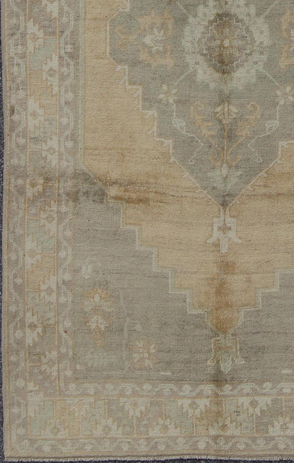 Muted Mid - 20th Century Vintage Oushak Rug with Medallion in Camel Measures: 5'5 x 9'4 This muted Turkish Oushak rests beautifully on a grounded camel - colored field. An understated medallion is well - balanced by four organic corner motifs, ... - Keivan Woven ArtsEN - 721 - 9236Rug