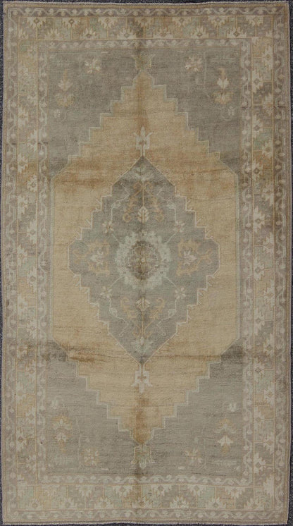 Muted Mid - 20th Century Vintage Oushak Rug with Medallion in Camel Measures: 5'5 x 9'4 This muted Turkish Oushak rests beautifully on a grounded camel - colored field. An understated medallion is well - balanced by four organic corner motifs, ... - Keivan Woven ArtsEN - 721 - 9236Rug