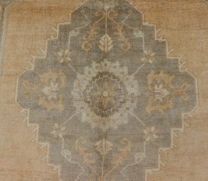 Muted Mid - 20th Century Vintage Oushak Rug with Medallion in Camel Measures: 5'5 x 9'4 This muted Turkish Oushak rests beautifully on a grounded camel - colored field. An understated medallion is well - balanced by four organic corner motifs, ... - Keivan Woven ArtsEN - 721 - 9236Rug