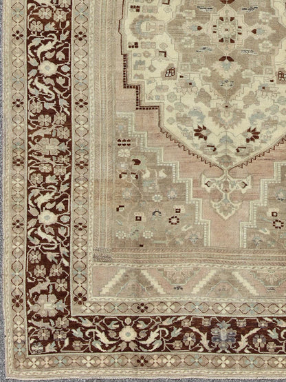 Charming Vintage Oushak Rug in Brown Border, Taupe, Blush and Gray/Green This rug showcases a large central medallion surrounded by a gentle pink color. A cream medallion is filled with floral designs of pale blue, light green, and shades of ne... - Keivan Woven ArtsEN - 786 - 3806Rug
