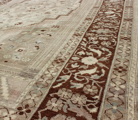 Charming Vintage Oushak Rug in Brown Border, Taupe, Blush and Gray/Green This rug showcases a large central medallion surrounded by a gentle pink color. A cream medallion is filled with floral designs of pale blue, light green, and shades of ne... - Keivan Woven ArtsEN - 786 - 3806Rug