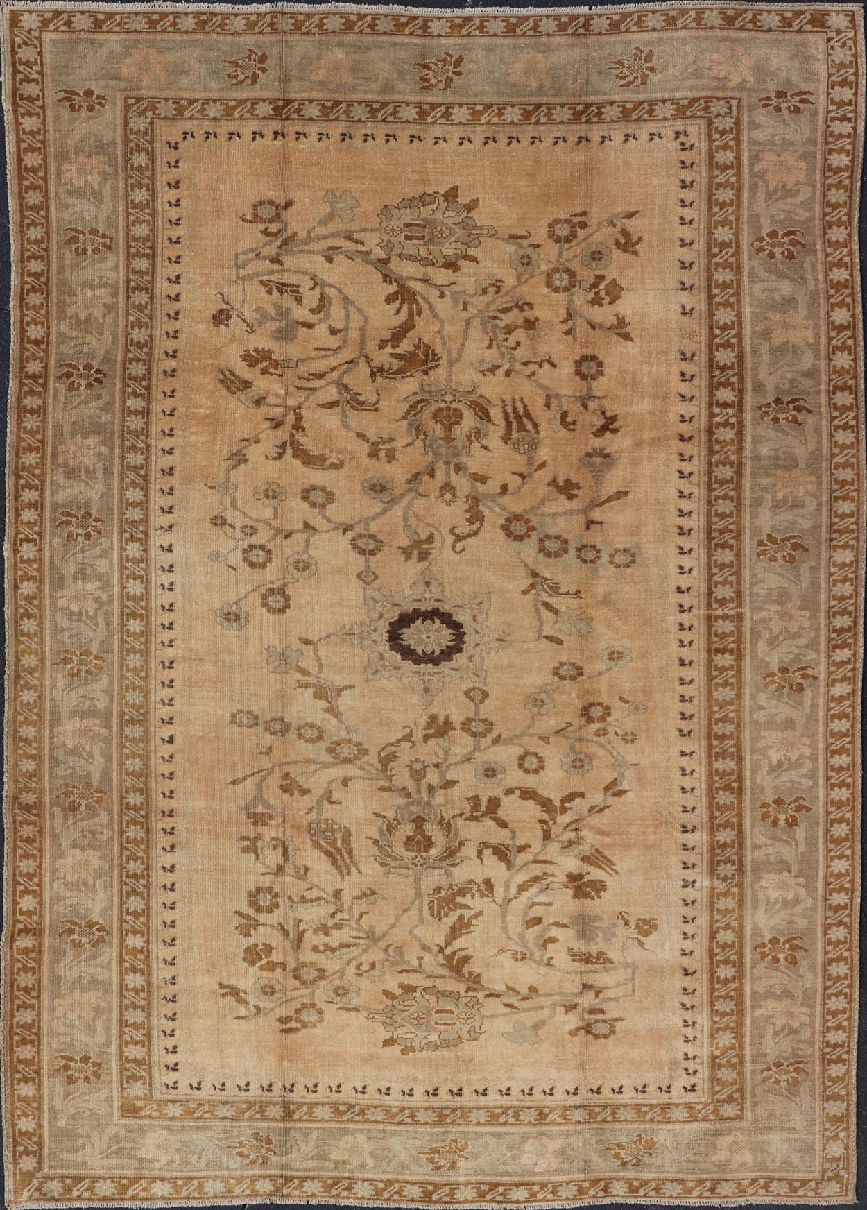 Vintage Turkish Oushak Rug with Detailed Vines and Flowers Measures: 6'9 x 9'11 The Oushak wool rug features two oversized medallions with detailed vines and flowers. A framework of floral motifs and stylized branches form the border and ... - Keivan Woven ArtsEN - 87601 - 870Rug