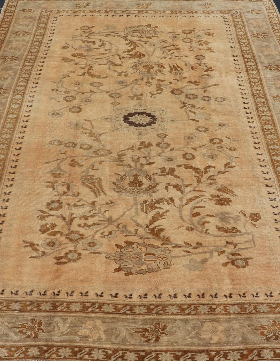 Vintage Turkish Oushak Rug with Detailed Vines and Flowers Measures: 6'9 x 9'11 The Oushak wool rug features two oversized medallions with detailed vines and flowers. A framework of floral motifs and stylized branches form the border and ... - Keivan Woven ArtsEN - 87601 - 870Rug