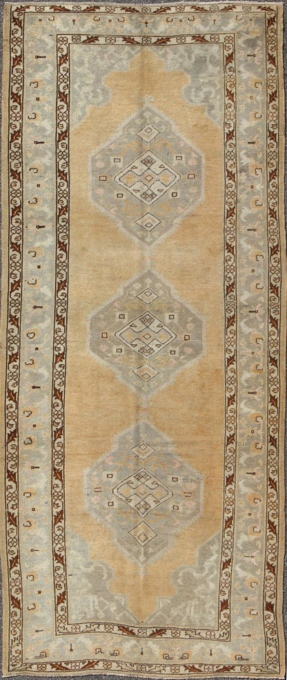 Vintage Turkish Oushak Runner With Stylized Medallions in Golden Peach, Light Green and Brown. rug en - 92478, country of origin / type: Turkey / Oushak, circa 1940 This vintage Turkish Oushak gallery runner (circa mid - 20th century) features a uni... - Keivan Woven ArtsEN - 92478 - 1454Rug