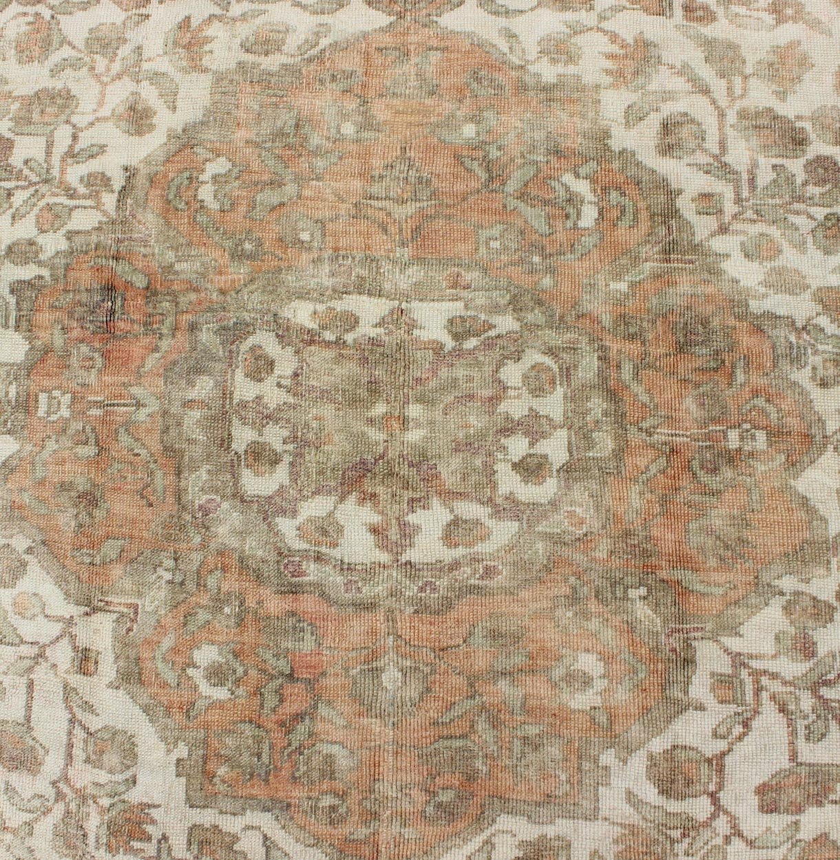 Vintage Turkish Oushak Rug in Peach, Ivory, Light Blue, and Light Green Measures: 6'9 x 9'3. This wonderful medallion Oushak features a soft color palette. The border has flowers connected by vines while the field also features a flower... - Keivan Woven ArtsEN - 92744 - 1656Rug