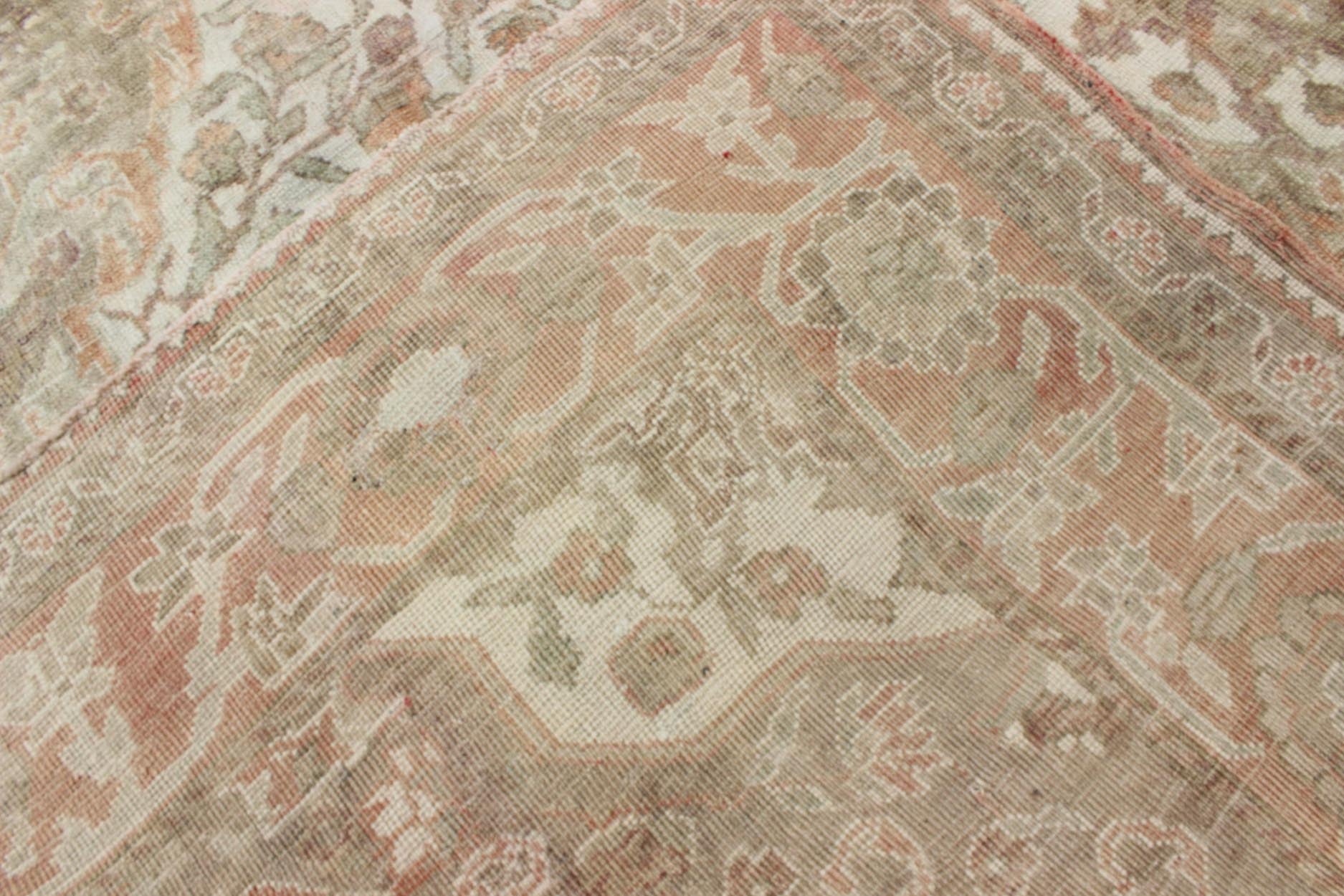 Vintage Turkish Oushak Rug in Peach, Ivory, Light Blue, and Light Green Measures: 6'9 x 9'3. This wonderful medallion Oushak features a soft color palette. The border has flowers connected by vines while the field also features a flower... - Keivan Woven ArtsEN - 92744 - 1656Rug