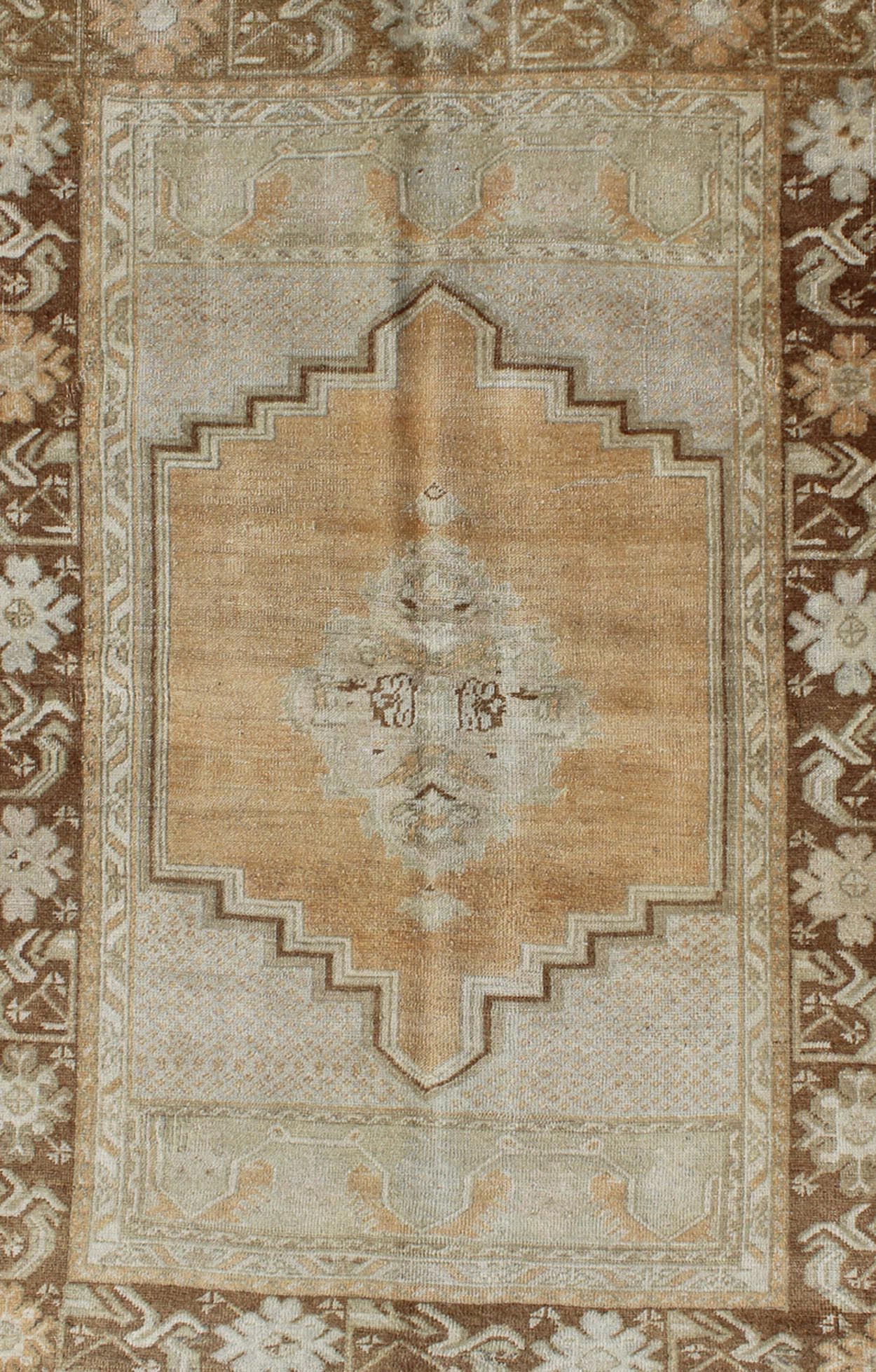 Vintage Oushak Rug in Brown, L. Orange, Camel & L. Taupe Gray. Vintage medallion Oushak in soft tones and brown border, Keivan Woven Arts/ rug, EN - 92950, Origin/ Turkey, Circa Mid century, All wool hand knotted vintage rug, Vintage Turkish rug, vintage... - Keivan Woven ArtsEN - 92950 - 1666Rug