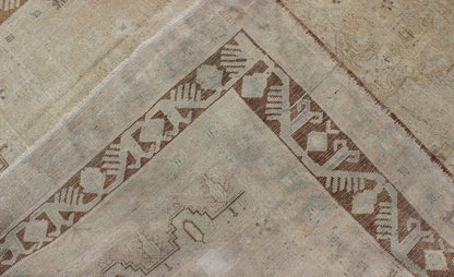Vintage Turkish Diamond Medallion Oushak in Neutral Earth Tones Measures: 5'8 x 9'1 Characterized by a comely and highly representative Oushak composition, this vintage Oushak carpet beautifully communicates the finer strength of Oushak r... - Keivan Woven ArtsEN - 946 - 7821Rug