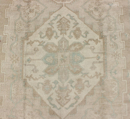 Turkish Vintage Oushak Medallion Rug With Muted Colors in Earth Tones. Keivan Woven Arts / rug EN - 951, country of origin / type: Turkey / Oushak, circa 1950. Measures: 6'9 x 10'5. This striking vintage Turkish Oushak rug bears an cream - colored bo... - Keivan Woven ArtsEN - 951 - 4874Rug