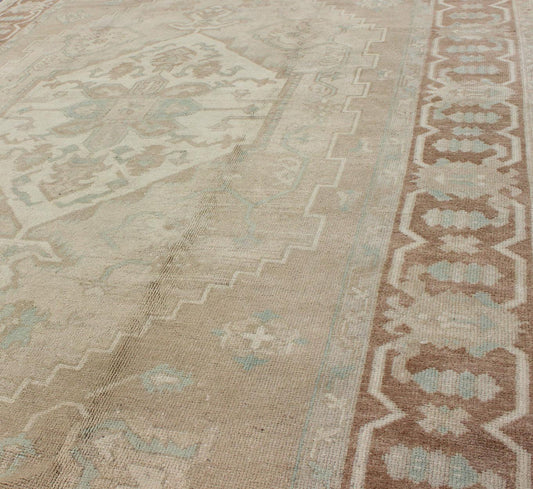 Turkish Vintage Oushak Medallion Rug With Muted Colors in Earth Tones. Keivan Woven Arts / rug EN - 951, country of origin / type: Turkey / Oushak, circa 1950. Measures: 6'9 x 10'5. This striking vintage Turkish Oushak rug bears an cream - colored bo... - Keivan Woven ArtsEN - 951 - 4874