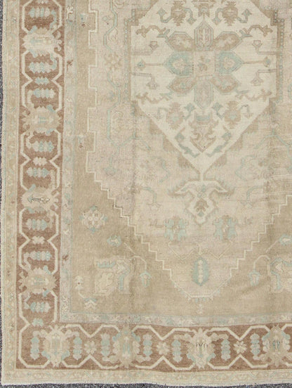 Turkish Vintage Oushak Medallion Rug With Muted Colors in Earth Tones. Keivan Woven Arts / rug EN - 951, country of origin / type: Turkey / Oushak, circa 1950. Measures: 6'9 x 10'5. This striking vintage Turkish Oushak rug bears an cream - colored bo... - Keivan Woven ArtsEN - 951 - 4874Rug