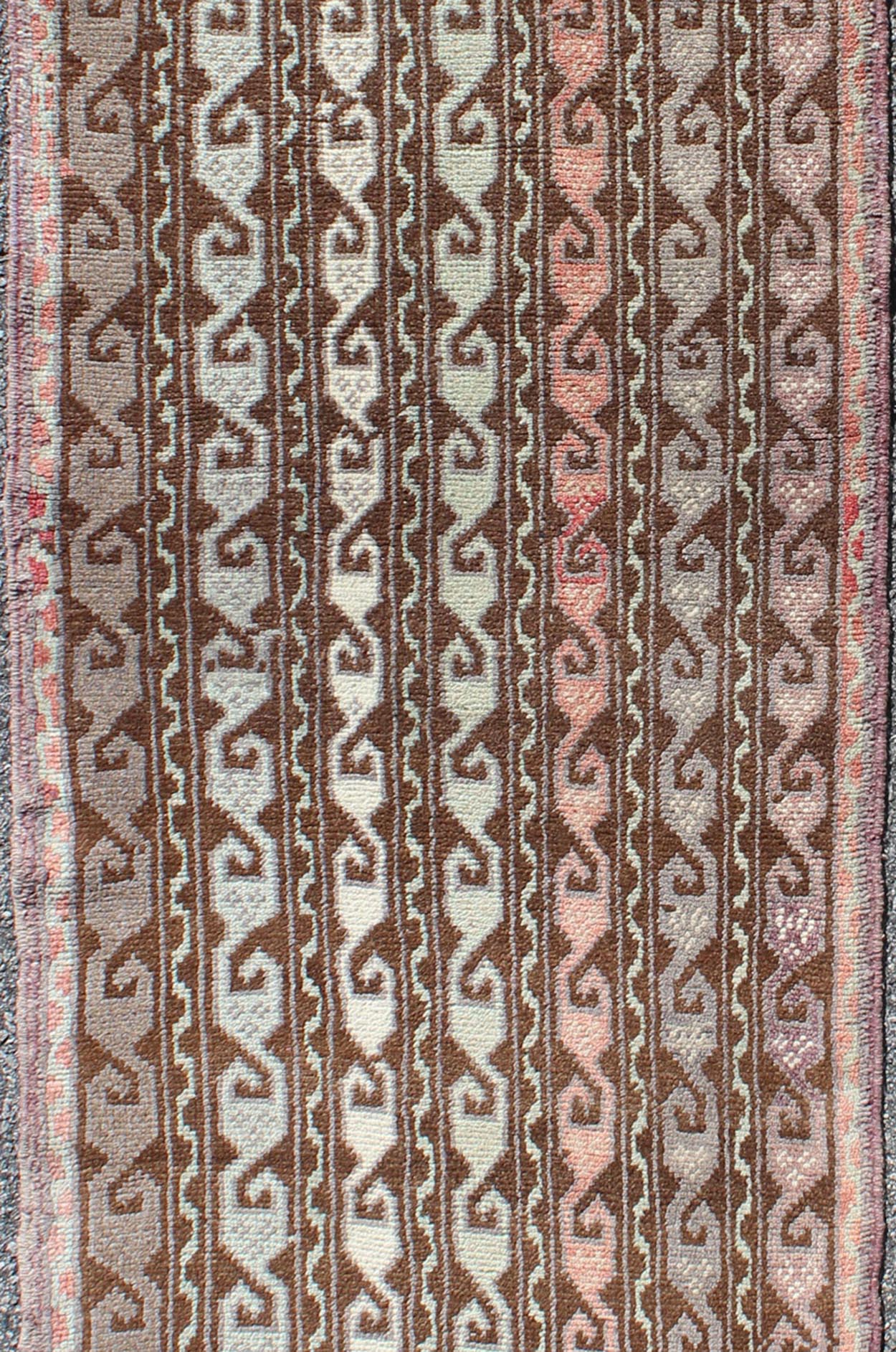 Brown and pastel - colored vintage Turkish Oushak runner with vining geometrics, rug en - 957, country of origin / type: Turkey / Oushak, circa 1930 This vintage Turkish gallery runner (circa 1930) features a unique blend of colors and an intricatel... - Keivan Woven ArtsEN - 957 - 3411Rug