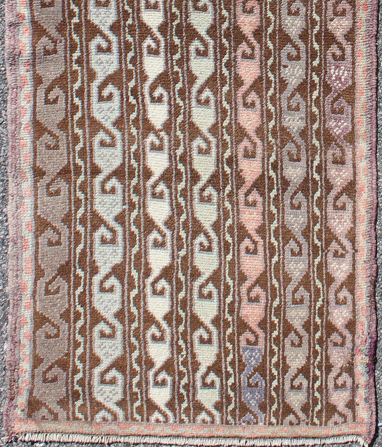 Brown and pastel - colored vintage Turkish Oushak runner with vining geometrics, rug en - 957, country of origin / type: Turkey / Oushak, circa 1930 This vintage Turkish gallery runner (circa 1930) features a unique blend of colors and an intricatel... - Keivan Woven ArtsEN - 957 - 3411Rug