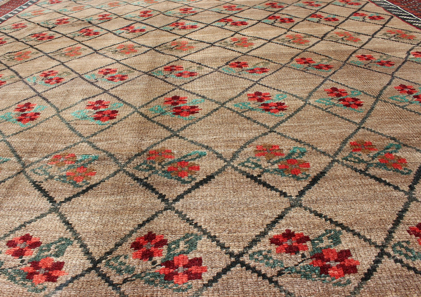 Turkish Konya Carpet in Camel Color Background, Red, Charcoal, Coral and Green. This colorful Turkish carpet rests beautifully upon a field of camel and light brown. A repeating flower pattern of taupe, green and gray takes center stage and is w... - Keivan Woven ArtsEN - 966 - 5434Rug