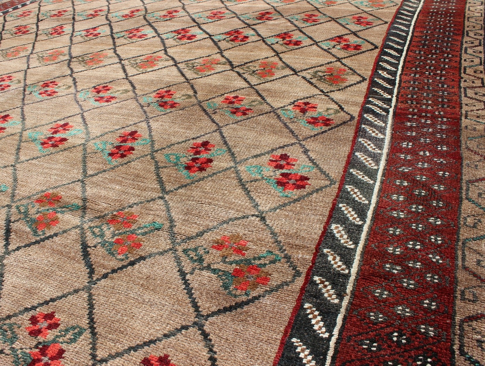 Turkish Konya Carpet in Camel Color Background, Red, Charcoal, Coral and Green. This colorful Turkish carpet rests beautifully upon a field of camel and light brown. A repeating flower pattern of taupe, green and gray takes center stage and is w... - Keivan Woven ArtsEN - 966 - 5434Rug