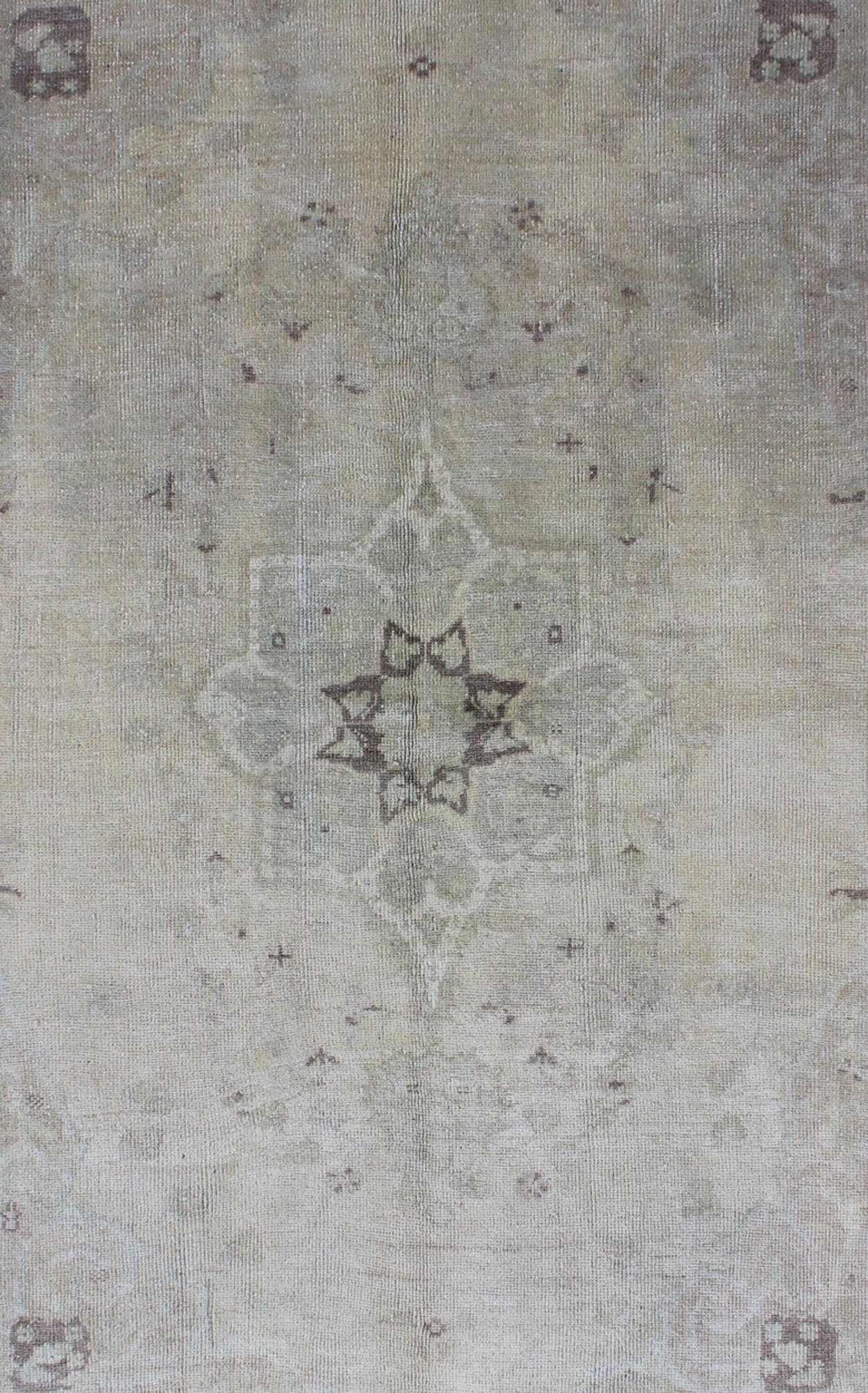 Muted Turkish Oushak Carpet with Centre Medallion Design in Grey, Sand & Taupe Turkish Oushak Carpet with Center Medallion Design rug/en - 977, origin/turkey kwarugs This magnificent muted Oushak from Turkey boasts a center medallion des... - Keivan Woven ArtsEN - 977 - 5977Rug