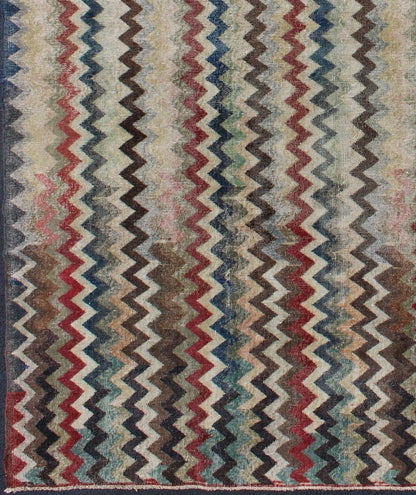 Mid - Century Turkish Modern Rug Rendered in zig - zag lines that run parallel to each other amidst an assortment of rich colors, this very unique rug showcases a modern design. Measures: 7'4 x 9'11. - Keivan Woven ArtsEN - 9801 - 4896Rug