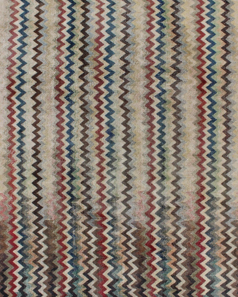 Mid - Century Turkish Modern Rug Rendered in zig - zag lines that run parallel to each other amidst an assortment of rich colors, this very unique rug showcases a modern design. Measures: 7'4 x 9'11. - Keivan Woven ArtsEN - 9801 - 4896Rug