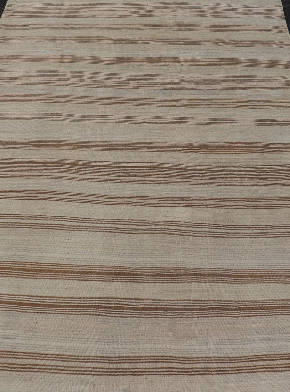 Vintage Turkish Kilim with Horizontal Stripes in Tan, Brown and Gray Measures: 4'10 x 8'2. This vintage flat - woven Kilim features a minimalist design rendered in stripes, set atop a light gray background with subtle brushes of tan, and br... - Keivan Woven ArtsEN - P13786 - 17976Rug