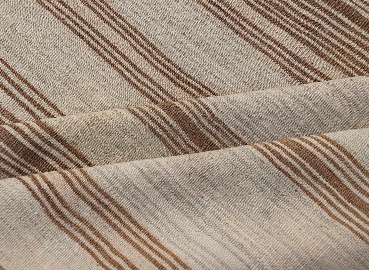 Vintage Turkish Kilim with Horizontal Stripes in Tan, Brown and Gray Measures: 4'10 x 8'2. This vintage flat - woven Kilim features a minimalist design rendered in stripes, set atop a light gray background with subtle brushes of tan, and br... - Keivan Woven ArtsEN - P13786 - 17976Rug