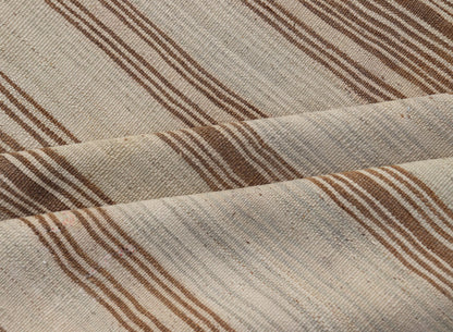Vintage Turkish Kilim with Horizontal Stripes in Tan, Brown and Gray Measures: 4'10 x 8'2. This vintage flat - woven Kilim features a minimalist design rendered in stripes, set atop a light gray background with subtle brushes of tan, and br... - Keivan Woven ArtsEN - P13786 - 17976Rug