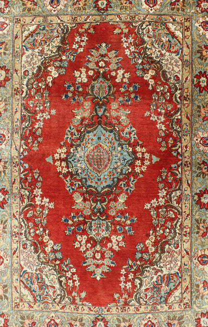 Fine Persian Qum Carpet with Red, Light Blue, Light Green, Navy and Brown This beautiful vintage Persian Qum rug bears a stretched central Medallion of blue with an impressive array of flora surrounding its body. The red field plays host to a de... - Keivan Woven ArtsF - 0701 - 1054Rug