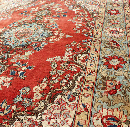 Fine Persian Qum Carpet with Red, Light Blue, Light Green, Navy and Brown This beautiful vintage Persian Qum rug bears a stretched central Medallion of blue with an impressive array of flora surrounding its body. The red field plays host to a de... - Keivan Woven ArtsF - 0701 - 1054Rug