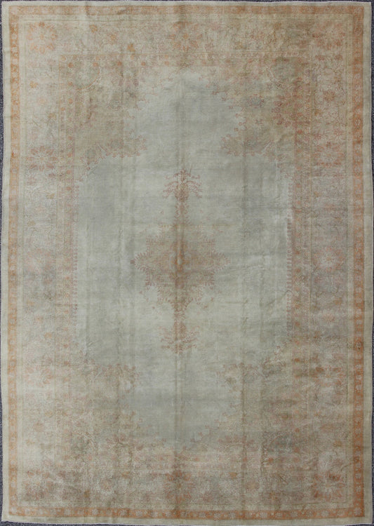Antique Turkish Oushak This stunning antique Turkish Oushak from the late 19th Century bears a remarkably sophisticated palette of soft colors such as taupe, silver, mocha and cream. The floral designs of the border and cornices reach inward to ... - Keivan Woven ArtsG - 0703 - 1710Rug