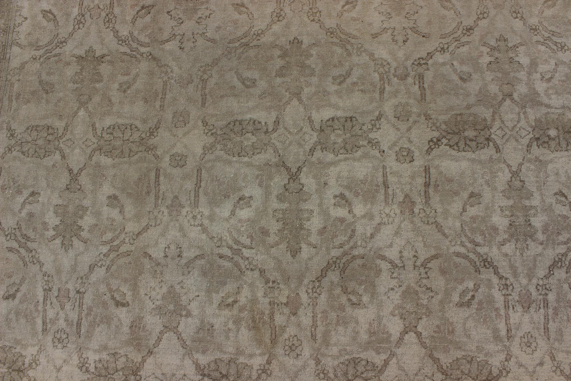 Neutral Colors Antique Indian Amritsar Gallery Rug in Ivory, Gray, and Taupe Measures: 7' x 12'9 This exquisite antique Indian Amritsar Gallery rug displays a breathtaking, muted palette with a sophisticated all - over design. A fabulous te... - Keivan Woven ArtsG - 0704 - 830Rug