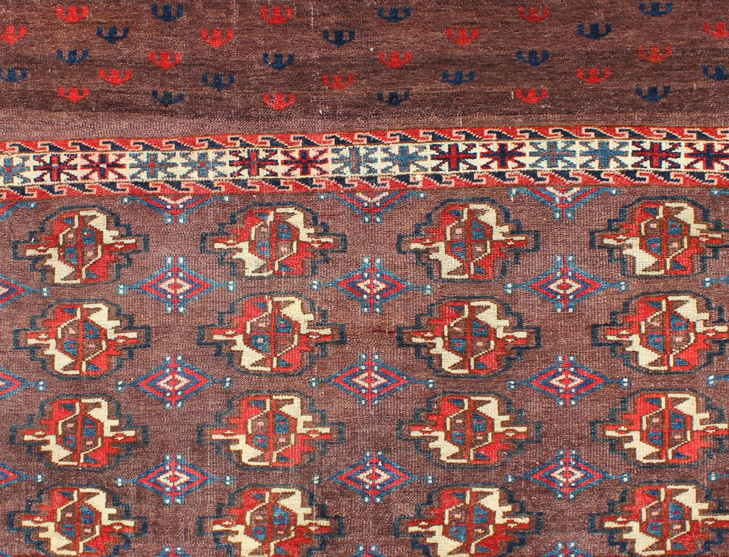 Early 20th Century Antique Tekke Rug with Brown Field and Tribal Motifs in Red, rugg - 1004, country of origin / type: Russia / Tribal, circa 1900 This piece is a rare antique Tekke carpet with delightful colors. The field consists of a chocolate ... - Keivan Woven ArtsG - 1004 - 2299Rug