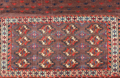 Early 20th Century Antique Tekke Rug with Brown Field and Tribal Motifs in Red, rugg - 1004, country of origin / type: Russia / Tribal, circa 1900 This piece is a rare antique Tekke carpet with delightful colors. The field consists of a chocolate ... - Keivan Woven ArtsG - 1004 - 2299Rug