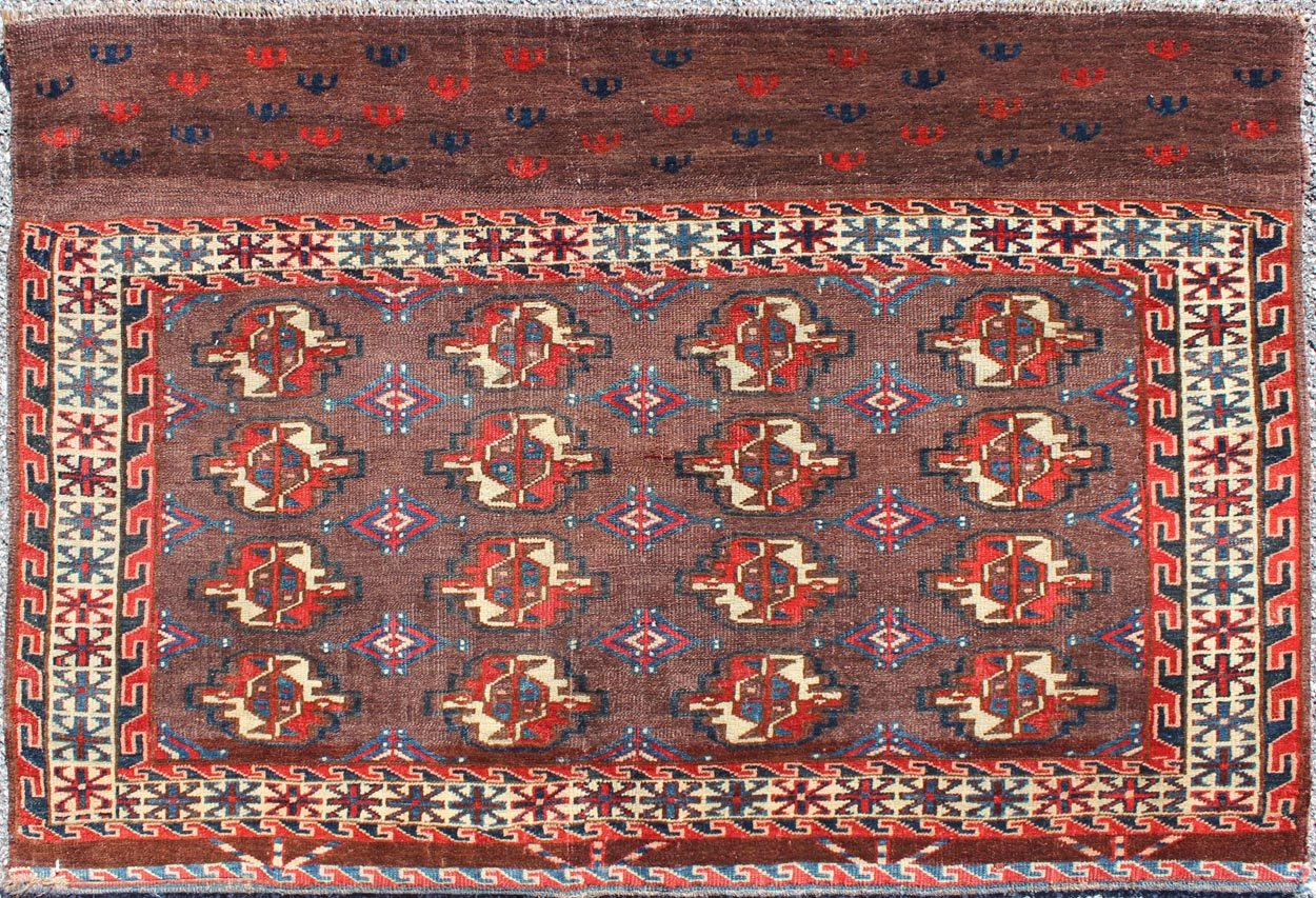 Early 20th Century Antique Tekke Rug with Brown Field and Tribal Motifs in Red, rugg - 1004, country of origin / type: Russia / Tribal, circa 1900 This piece is a rare antique Tekke carpet with delightful colors. The field consists of a chocolate ... - Keivan Woven ArtsG - 1004 - 2299Rug