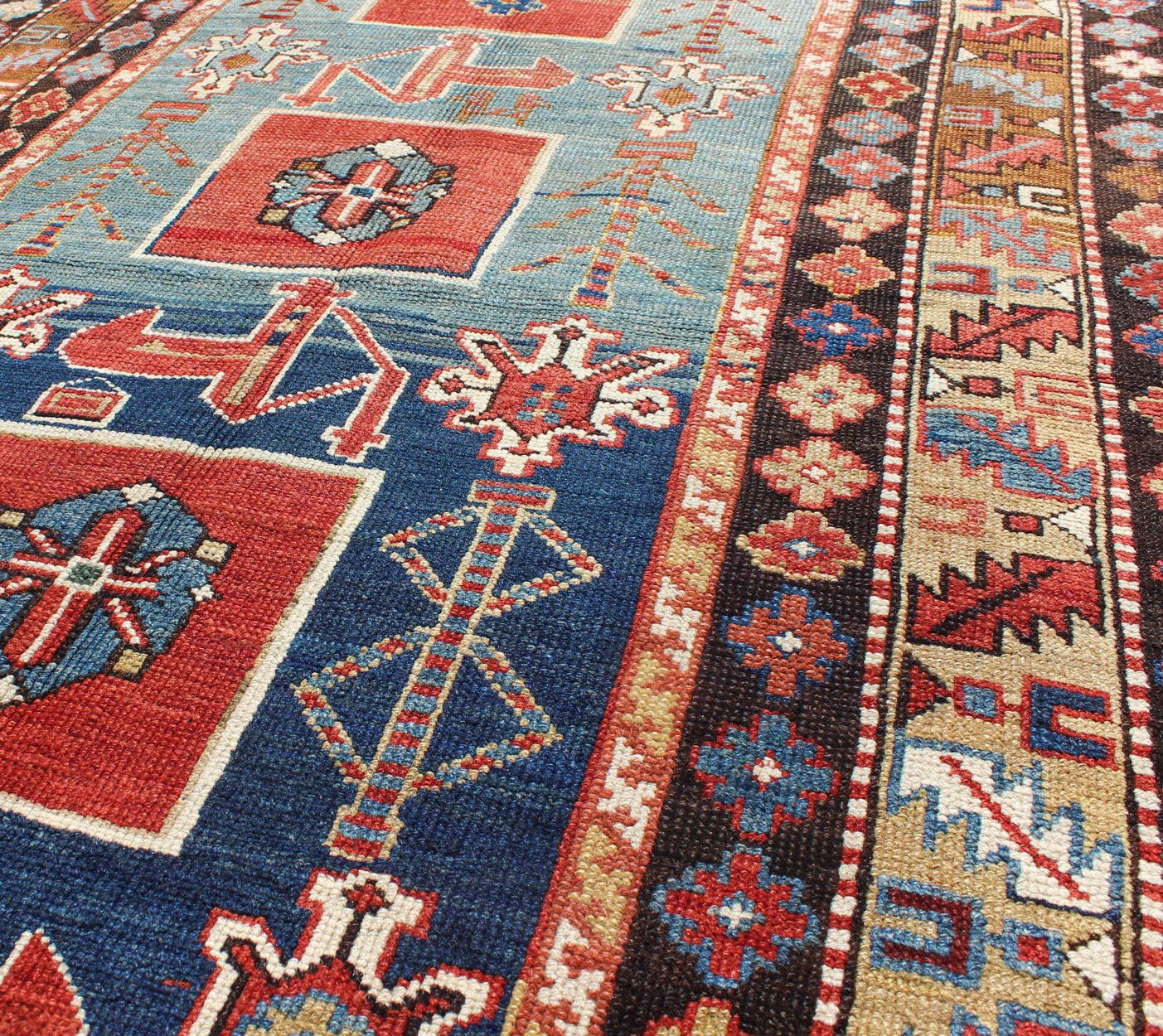 Antique Hand Knotted Qaraqashli Caucasian Rug with Tribal Medallion Design The archetypal motifs in this piece are accompanied by a tower of stacked polygons with small tribal design. Each decorative foil is embellished with eight - armed brac... - Keivan Woven ArtsG - 1203 - 2643Rug