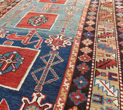 Antique Hand Knotted Qaraqashli Caucasian Rug with Tribal Medallion Design The archetypal motifs in this piece are accompanied by a tower of stacked polygons with small tribal design. Each decorative foil is embellished with eight - armed brac... - Keivan Woven ArtsG - 1203 - 2643Rug