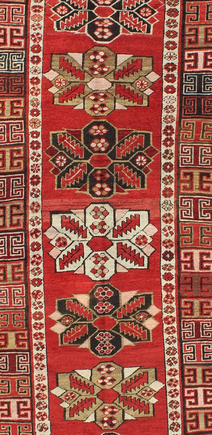 Red background antique Kazak runner with medallions and tribal design, Keivan Woven Arts / rug g - 1204, country of origin / type: Caucasus / Kazak, circa 1900 The field design of this antique Kazak runner features medallions of differing colors s... - Keivan Woven ArtsG - 1204 - 2271Rug