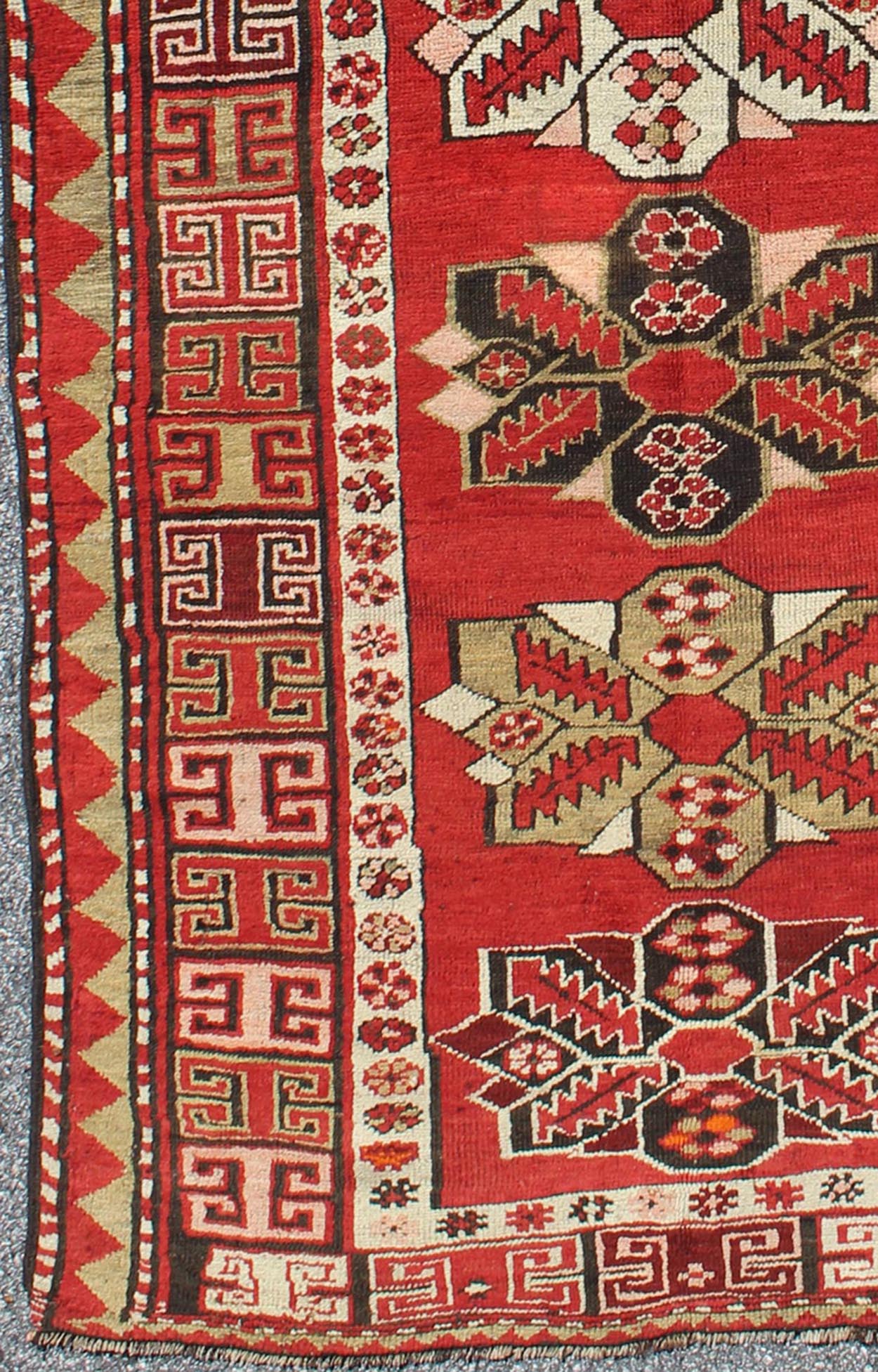 Red background antique Kazak runner with medallions and tribal design, Keivan Woven Arts / rug g - 1204, country of origin / type: Caucasus / Kazak, circa 1900 The field design of this antique Kazak runner features medallions of differing colors s... - Keivan Woven ArtsG - 1204 - 2271Rug