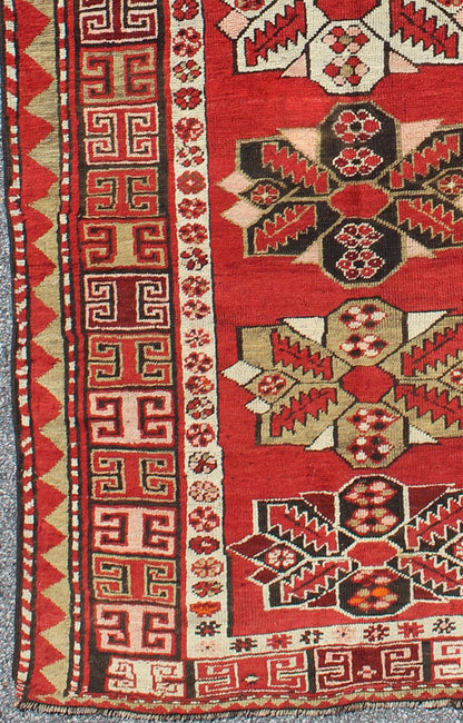 Red background antique Kazak runner with medallions and tribal design, Keivan Woven Arts / rug g - 1204, country of origin / type: Caucasus / Kazak, circa 1900 The field design of this antique Kazak runner features medallions of differing colors s... - Keivan Woven ArtsG - 1204 - 2271Rug