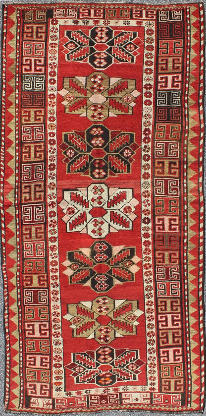 Red background antique Kazak runner with medallions and tribal design, Keivan Woven Arts / rug g - 1204, country of origin / type: Caucasus / Kazak, circa 1900 The field design of this antique Kazak runner features medallions of differing colors s... - Keivan Woven ArtsG - 1204 - 2271Rug