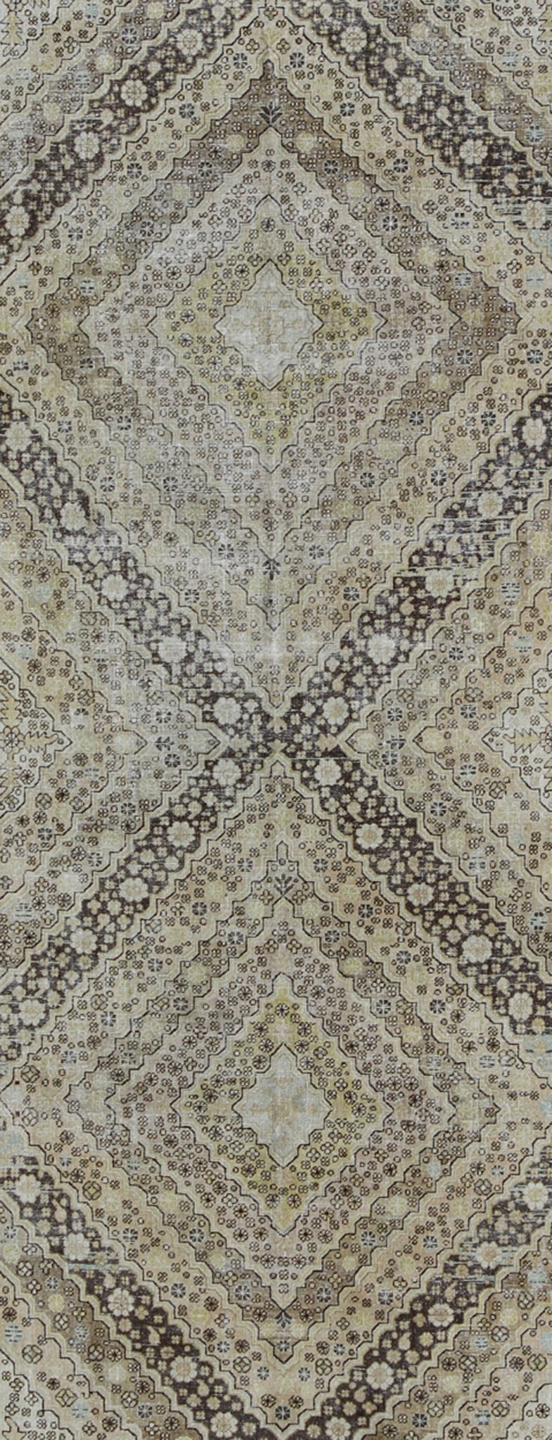 Antique Turkestanian Khotan rug with paired diamond geometric medallions, rug gld - 8495, country of origin / type: East Turkestan / Khotan, circa 1910. This delicately rendered antique Khotan rug was handcrafted in Turkestan during the early part... - Keivan Woven ArtsGLD - 8495 - 9098Rug