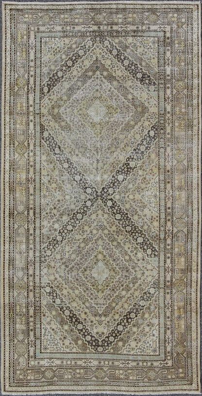 Antique Turkestanian Khotan rug with paired diamond geometric medallions, rug gld - 8495, country of origin / type: East Turkestan / Khotan, circa 1910. This delicately rendered antique Khotan rug was handcrafted in Turkestan during the early part... - Keivan Woven ArtsGLD - 8495 - 9098Rug